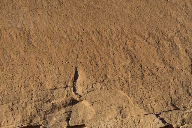 A cracked and weathered stone surface.