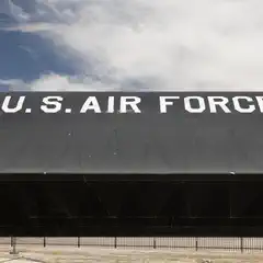 A long, black aircraft spans the horizontal frame with white lettering reading "U.S. AIR FORCE".