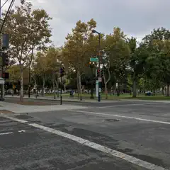 An intersection is visible, with a street sign reading 'St. James St.' and a park area beyond.