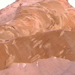 A sandstone formation displays layered, undulating rock surfaces in shades of orange and red.