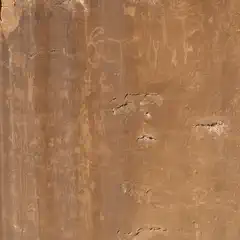 A smooth, red sandstone cliff face covered with dozens of petroglyphs.