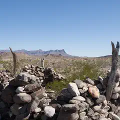 An old stone structure comprised of large rocks stacked on top of each other.