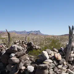 An old stone structure comprised of large rocks stacked on top of each other.