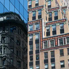 A tan brick building with numerous rectangular windows stands adjacent to a glass-faced building reflecting other structures.